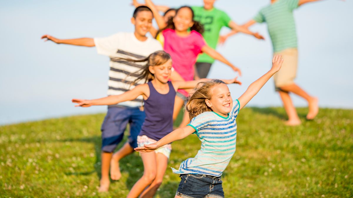 Group of students playing in a field