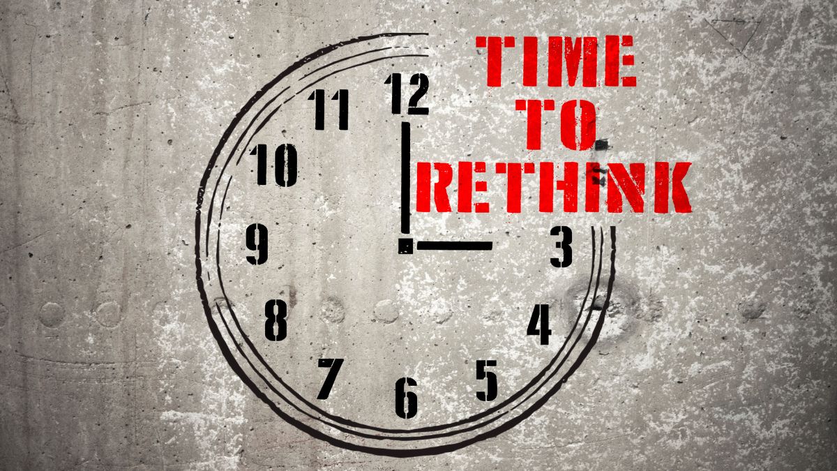 A figure of a clock with the words “Time to Rethink”