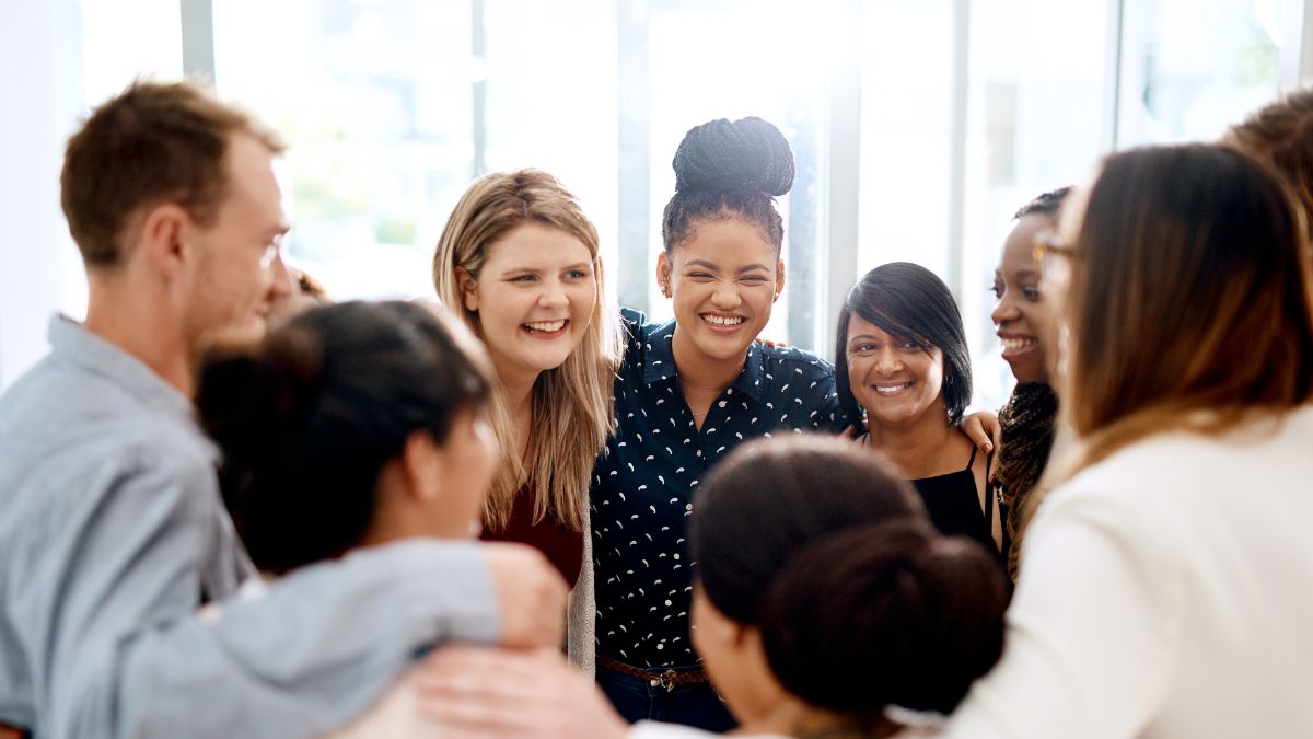 A team of employees showing support to each other